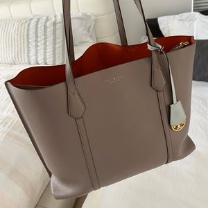 Great quality Tory Burch. A nice and easy tote to fit laptop and more.